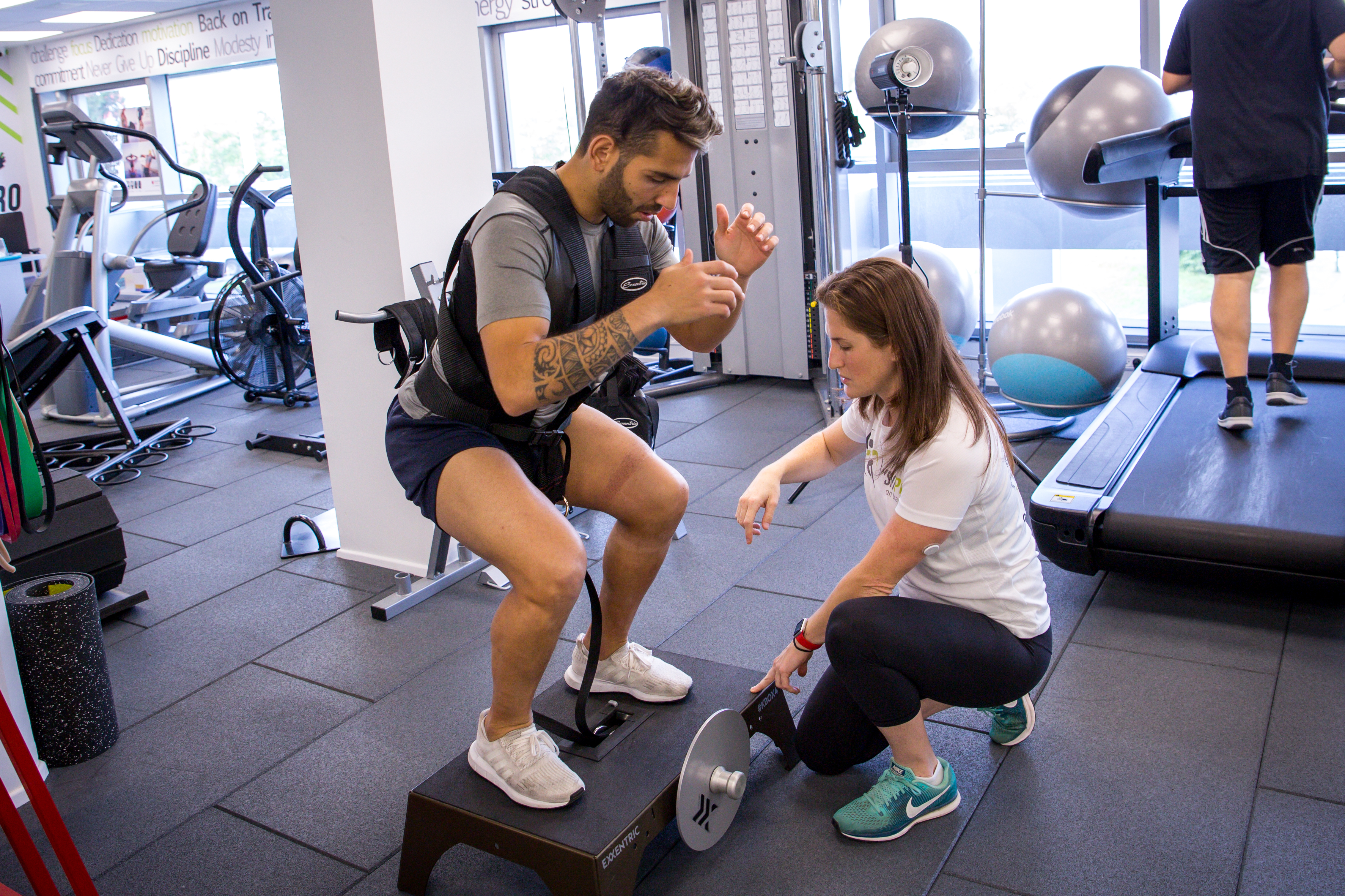 Shana coaching a client through rehabilitation